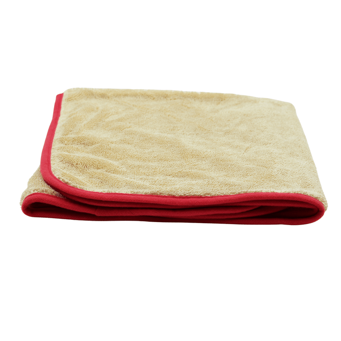 Folded beige Fireball Pin-Twist Drying Towel with red border, showcasing soft microfiber texture and absorbent design on white background